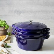 STAUB Stackable 4-in-1 Cast Iron Cookware Set features a cocotte, braiser, grill pan, and universal lid, ideal for versatile cooking and efficient storage.
