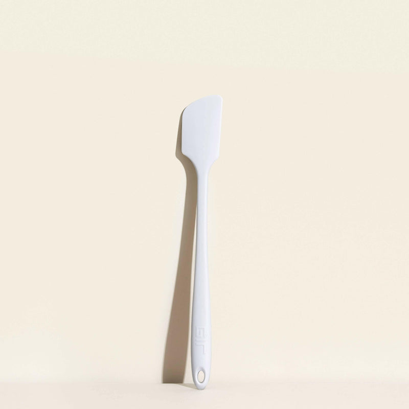 GIR | Skinny Spatula - Studio White, a sleek kitchen tool with antimicrobial unibody design, ideal for precise cooking tasks.