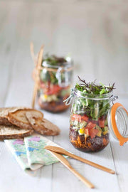 Le Parfait Rounded French Glass Storage Jars filled with layered salads, showcasing their versatile use for stylish food presentation and efficient storage.