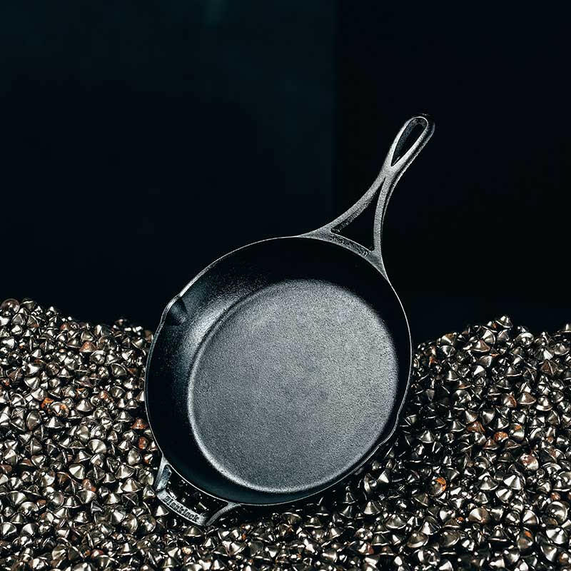 Lodge | Blacklock Skillets - Set of 2 | 10.25 & 12 cast-iron pans showcased close-up, emphasizing lightweight, triple seasoned design for versatile cooking on various heat sources.