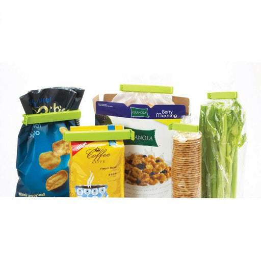 Twixit! Bag Clips - Set of 8 shown sealing a plastic bag, ideal for keeping various foods fresh, reducing waste, and organizing storage efficiently.