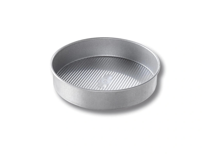 USA Pan | Cake Pans - 12 in Round featuring a ridged texture for even heat distribution, coated with FDA-approved Americoat® for effortless release and easy cleanup.