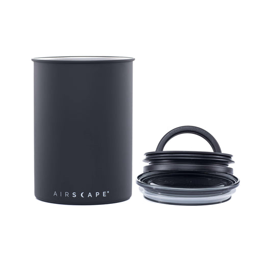 Close-up of the Planetary Design Airscape Classic Canister in matte gray, featuring a stainless steel body designed to preserve food freshness by expelling air.