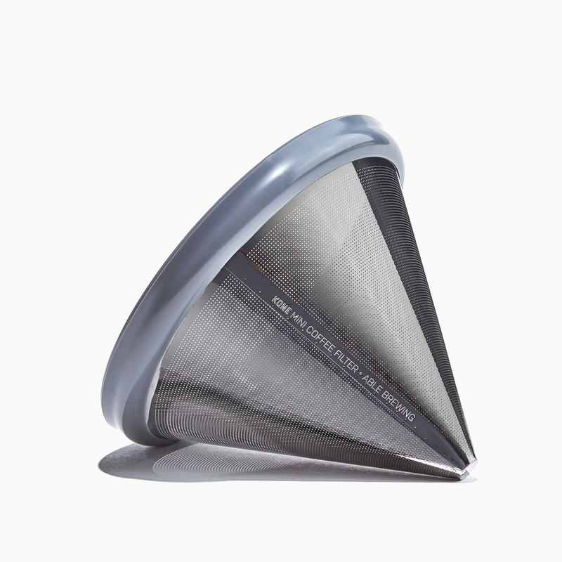 Able | Coffee Filters - Mini Kone, a silver strainer designed for eco-friendly brewing with Hario V60 02, offering café-quality coffee at home.