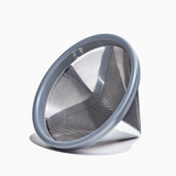 Able | Coffee Filters - Basket: A close-up of the silver, triangle-shaped Kone Mini filter, designed for eco-friendly, café-quality coffee brewing with Hario V60 02 drippers.