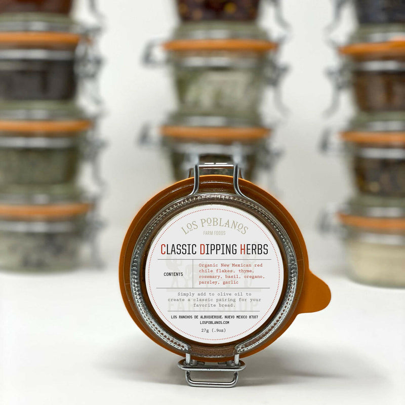 Los Poblanos | Dipping Herbs - Chile Verde Flakes in a glass jar, showcasing a blend of New Mexican Sabinal chiles and spices for enhancing dishes.
