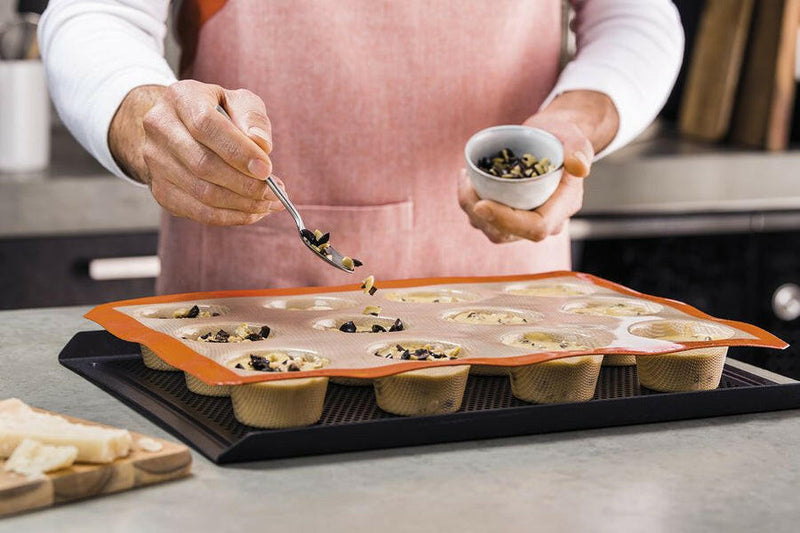 Silpat Reusable Silicone Baking Molds - Tartelette Mold featuring 12 round wells for perfectly shaped pastries, ideal for baking enthusiasts seeking durable, non-stick bakeware solutions.