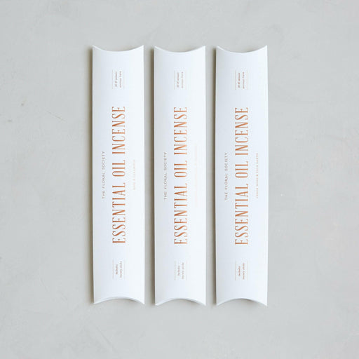 The Floral Society's handcrafted essential oil incense, featuring earthy and citrusy Cedar Wood & Palo Santo, displayed in packaging with 20 sticks for calming ambiance.