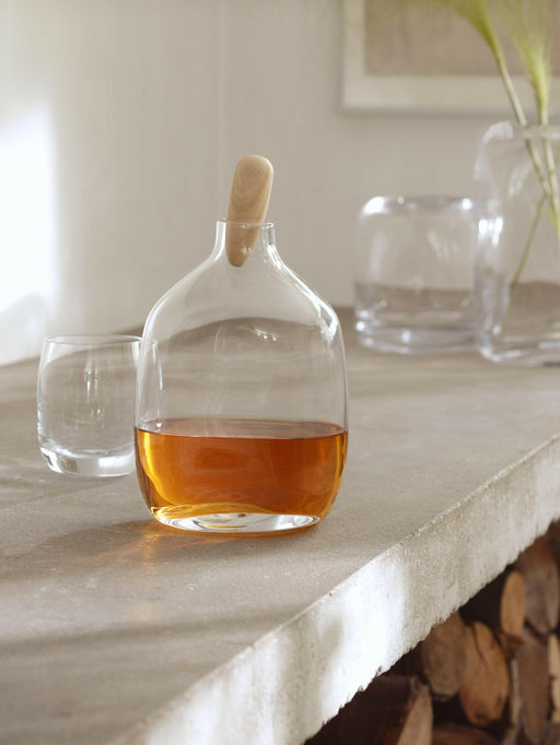 LSA International Float Decanter features a mouth-blown glass vessel with a walnut stopper, expertly designed for serving spirits, ideal for a stylish home bar.