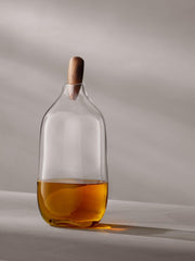 LSA International Float Decanters with walnut stoppers, featuring mouth-blown glass design, ideal for enhancing any home bar.
