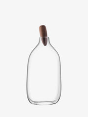 LSA International Float Decanters with walnut stoppers, showcasing sleek, mouth-blown glass design, ideal for enhancing any home bar setup.