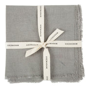 Sir|Madam Linen Frayed Edge Napkins - Curry - Set of 4, neatly tied with a white ribbon, showcasing their simple, elegant design.