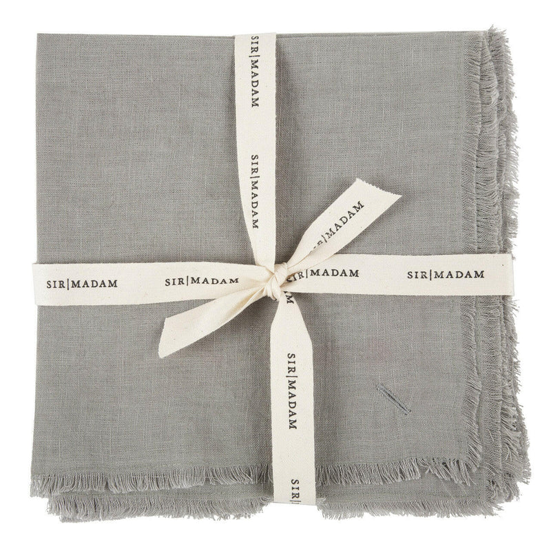 Sir|Madam Linen Frayed Edge Napkins - Curry - Set of 4, neatly tied with a white ribbon, showcasing their simple, elegant design.