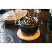 Staub | Magnetic Trivets - Oval 11.25, crafted from hardwood, designed for STAUB Cocottes, offering stylish heat protection up to 200°C, perfect for elegant dining.