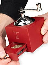 Peugeot | Roellinger Pepper Mill, 5 inches - Red: Manual tabletop grinder with hand-crank and pull-out drawer for grinding beans or spices, inspired by traditional designs.