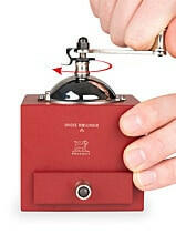 Peugeot | Roellinger Pepper Mill, 5 inches - Red, featuring a traditional design with a handle and drawer for easy storage, ideal for grinding spices.