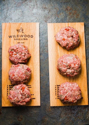 Close-up of Wildwood Grilling | 5 Flavor Grilling Plank Sampler Pack - Medium, showcasing the texture of raw meatball for a unique flavor infusion experience.