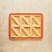 Silpat Reusable Silicone Baking Molds - Tartelette Mold, featuring a 12-hole design for crafting perfectly shaped pastries and individual quiches, measuring 11 5/8 x 16 1/2.