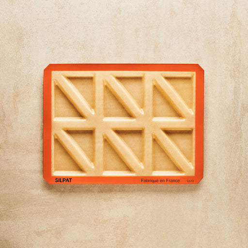 Silpat Reusable Silicone Baking Molds - Tartelette Mold, featuring a 12-hole design for crafting perfectly shaped pastries and individual quiches, measuring 11 5/8 x 16 1/2.