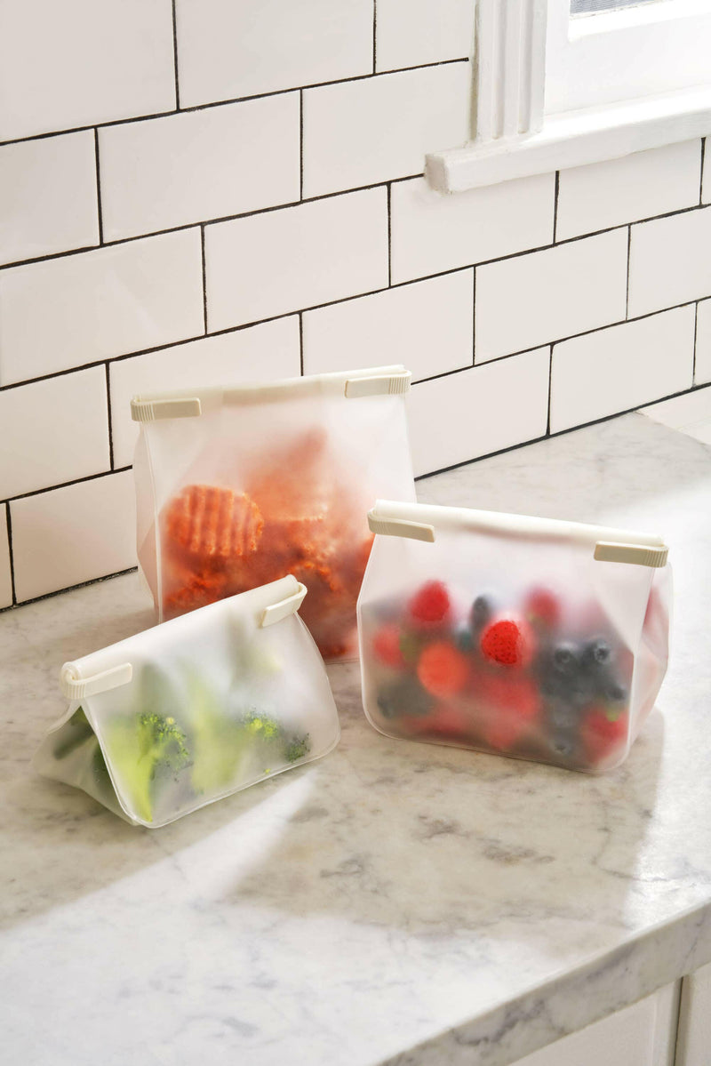 Three W&P Roll Tight Storage Bags shown, each with a bendable crimping bar for airtight storage. Ideal for organizing kitchens with reusable, food-safe materials.
