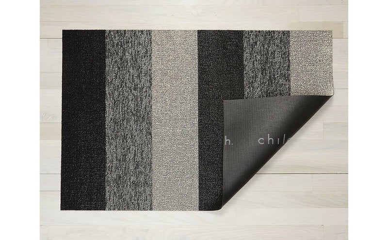 Chilewich | Marbled Stripe Shag Mats - Salt and Pepper, 24 x 36, featuring a looped top layer on a slip-resistant vinyl base, ideal for high-traffic areas.