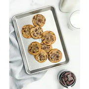 USA Pan | Sheet Pans - Half Sheet Pan: A versatile mini sheet pan ideal for toaster ovens, featuring Americoat® nonstick silicone and a fluted design for enhanced baking.