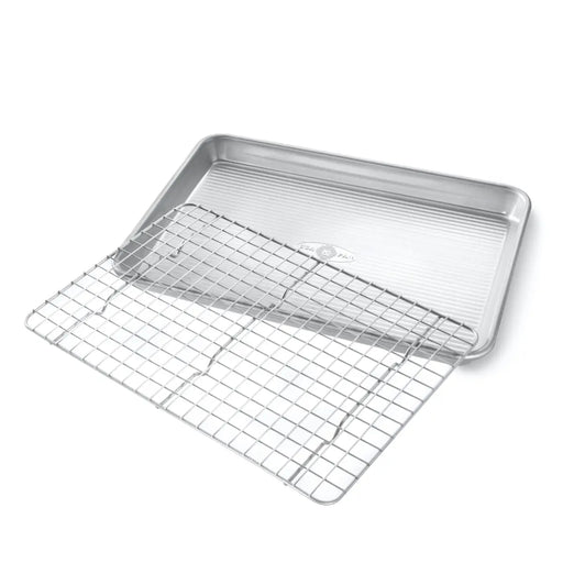 USA Pan | Sheet Pans + Rack Sets - Extra Large Sheet Pan + Baking Rack displayed, highlighting its steel cross-wire design and elevated feet for efficient baking and cooling.