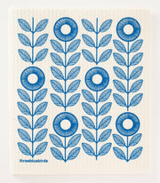 Three Bluebirds Swedish Dishcloths feature intricate blue and white circular motifs, offering sustainable, stylish functionality for kitchen chores.