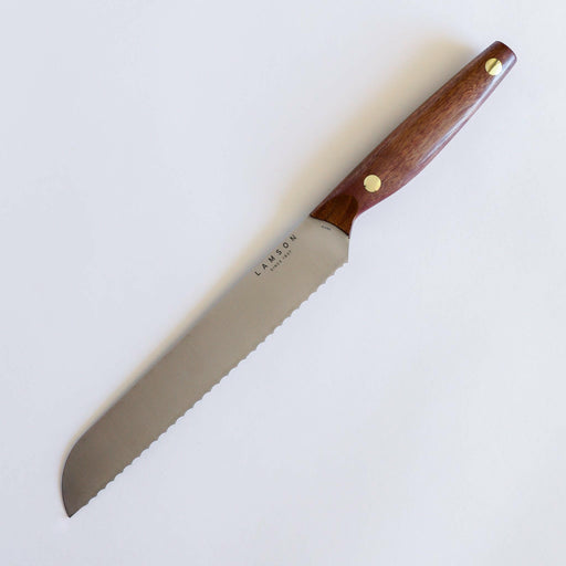 Lamson Vintage 8 Bread Knife featuring a full-tang blade of Hi-Carbon American Steel and ergonomic hardwood handle with brass rivets, ideal for versatile kitchen tasks.