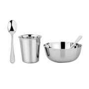 Ahimsa | Stainless Steel Kids Dishes - Fork + Spoon Set - Classic, featuring a close-up of a spoon in a bowl, highlighting durable, child-friendly kitchenware.