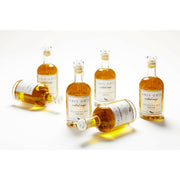 Gris Gris | Cocktail Magic Simple Syrup - Yuzu Serrano in a glass bottle, featuring a blend of peppers and herbs for enhancing cocktails.