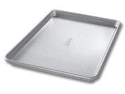 USA Pan | Sheet Pans - Half Sheet Pan designed for toaster ovens, featuring Americoat® nonstick silicone and a fluted design for enhanced baking performance.