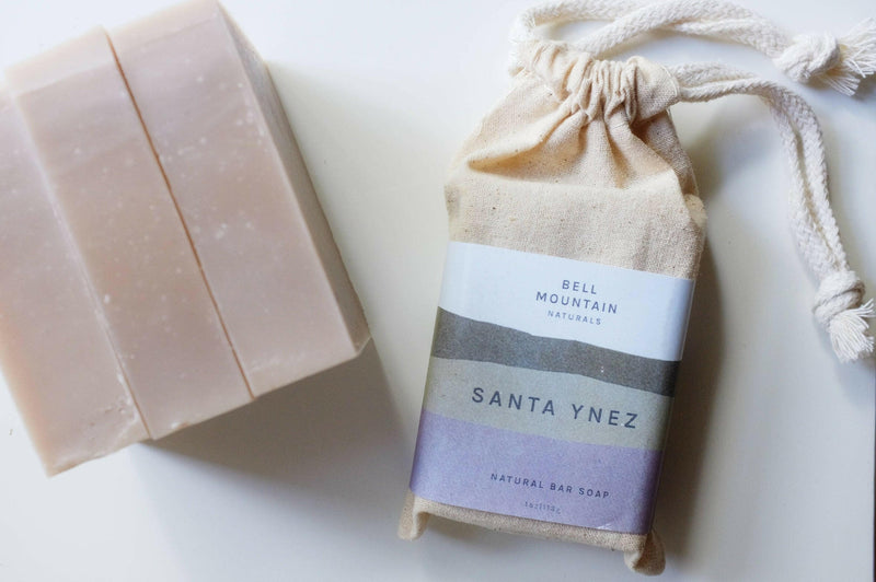 Bell Mountain | Bar Soaps - Solstice: A bar of plant-based soap beside its labeled fabric bag, ideal for a natural skincare routine.