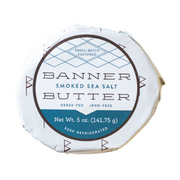 Banner Butter - Lemon Chive in a round blue and white package, showcasing gourmet butter enhanced with lemon and chive flavors, perfect for elevating meals.