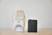 Bell Mountain | Bar Soaps - Solstice, featuring a bar of soap with a rainbow design, accompanied by a matching white bag with a rainbow label.