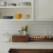 Alabama Sawyer's Noaway Petite Countertop Compost Bin in Magnolia seamlessly integrates with kitchen decor, promoting eco-friendly composting with a discreet, easy-to-clean design.